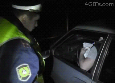 Cop-punches-window.gif